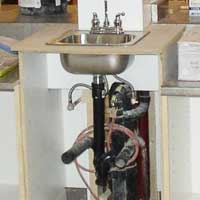 faucet and drain repairs, sink and countertop installation